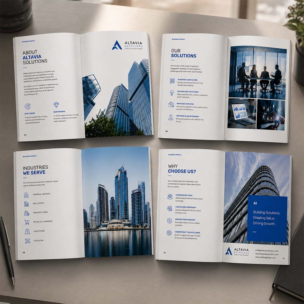 Open company profile brochures showing corporate services and business information