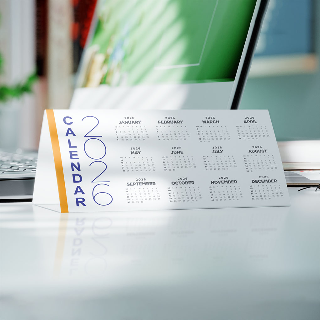 Custom printed desk calendar displayed on an office desk