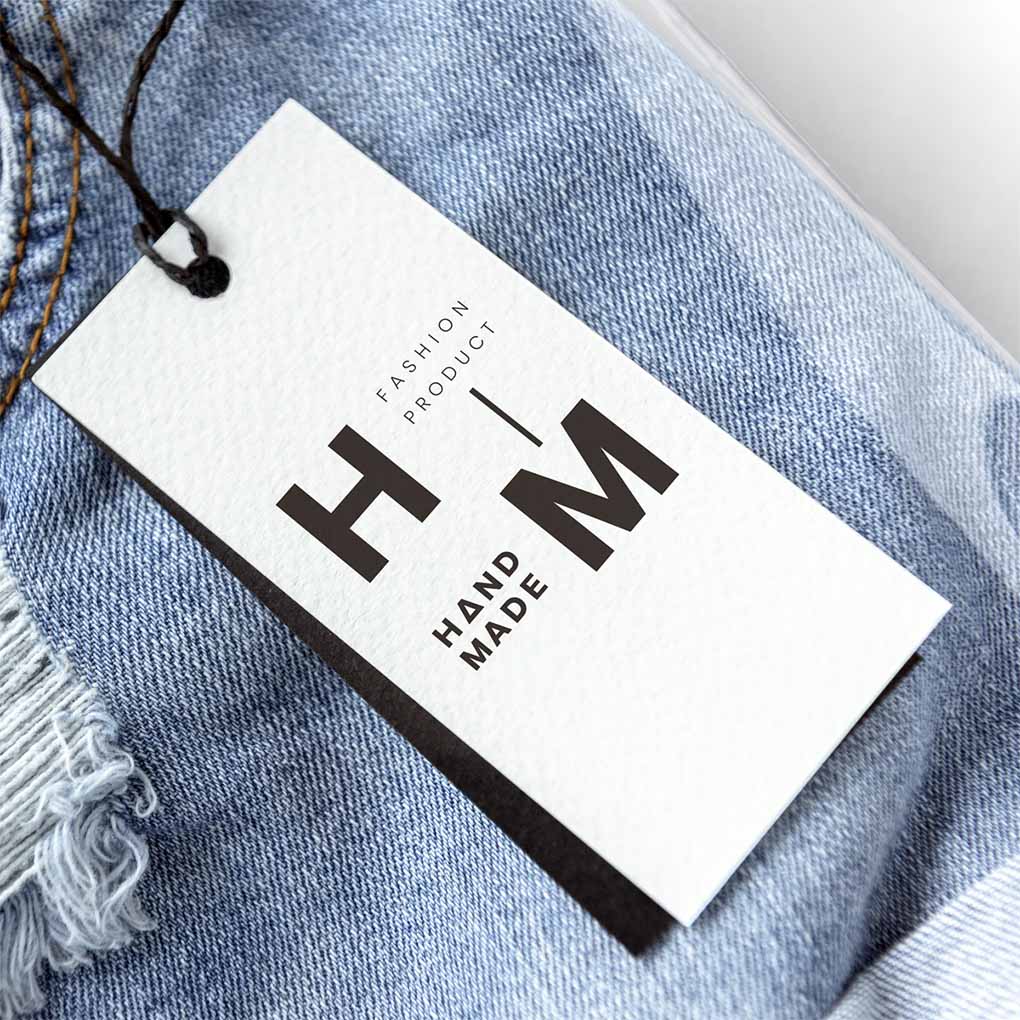 Garment clothing tag printing in Dubai with custom fashion branding for jeans and apparel products