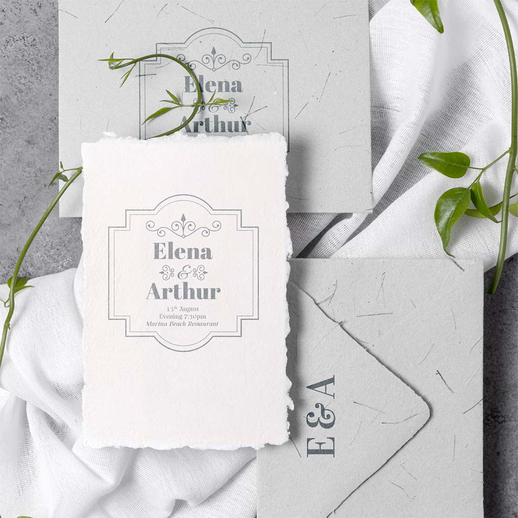 Custom wedding invitation printing in Dubai with elegant textured card and matching envelopes