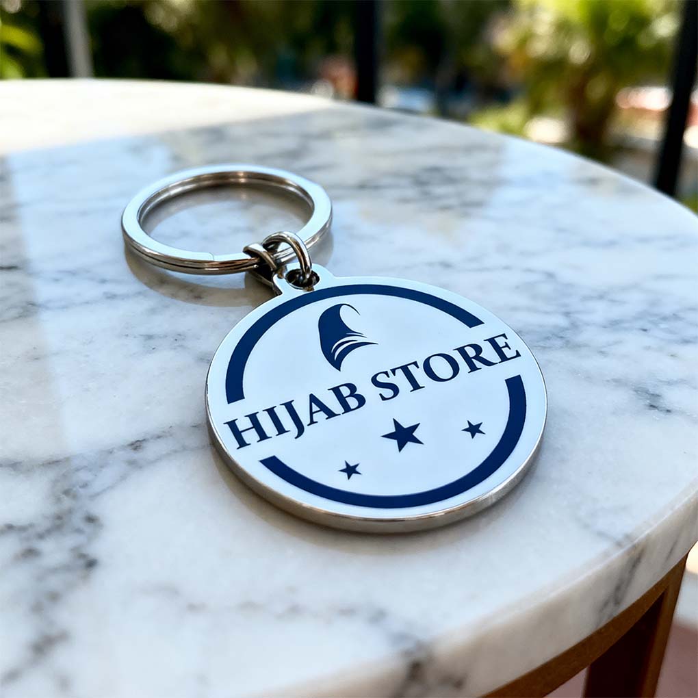 Round metal keychain printing in Dubai with custom company logo for promotional giveaways
