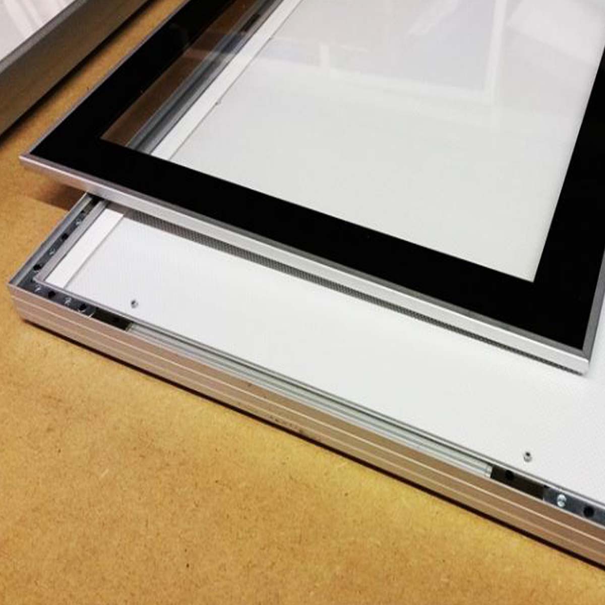 Slim magnetic LED light box frame with snap front panel for advertising displays in Dubai