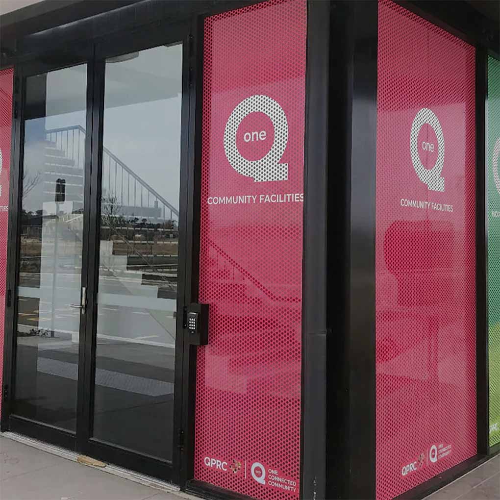 Commercial one way vision graphics installed on glass doors and windows for branded business advertising in Dubai