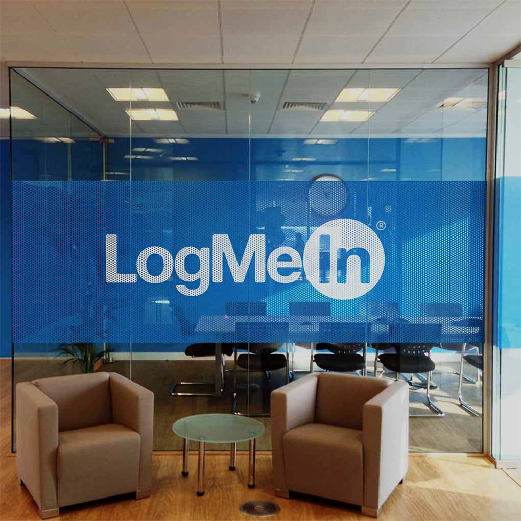 Custom one way vision printing on office glass partition for branded privacy graphics in Dubai