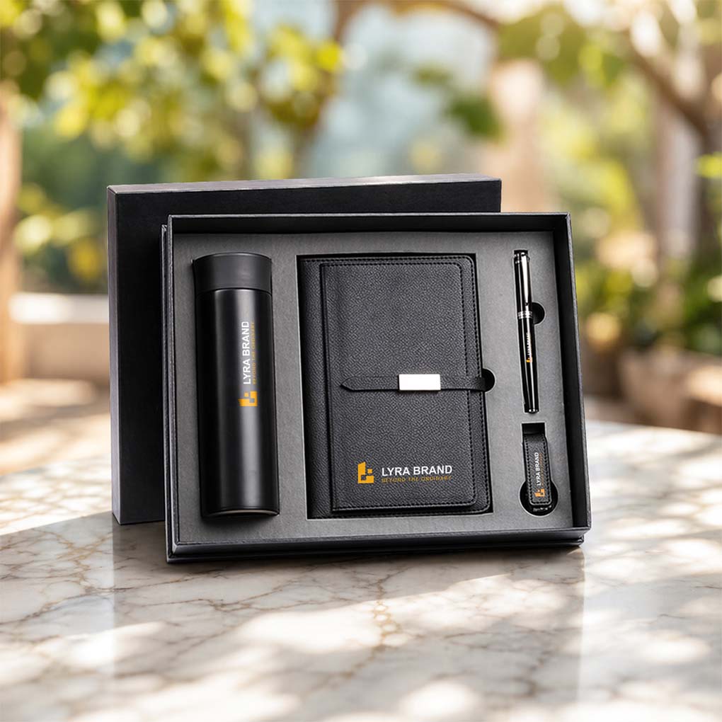 Custom corporate gift set with branded notebook, thermal bottle, pen and keychain with company logo in Dubai UAE